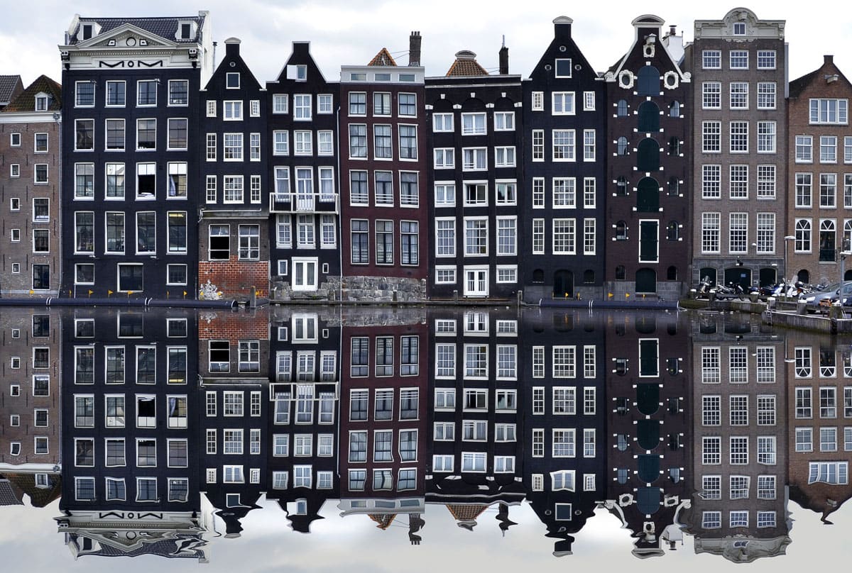 Beautiful mirror reflections of the Dutch houses in Amsterdam