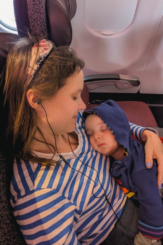 baby asleep on plane